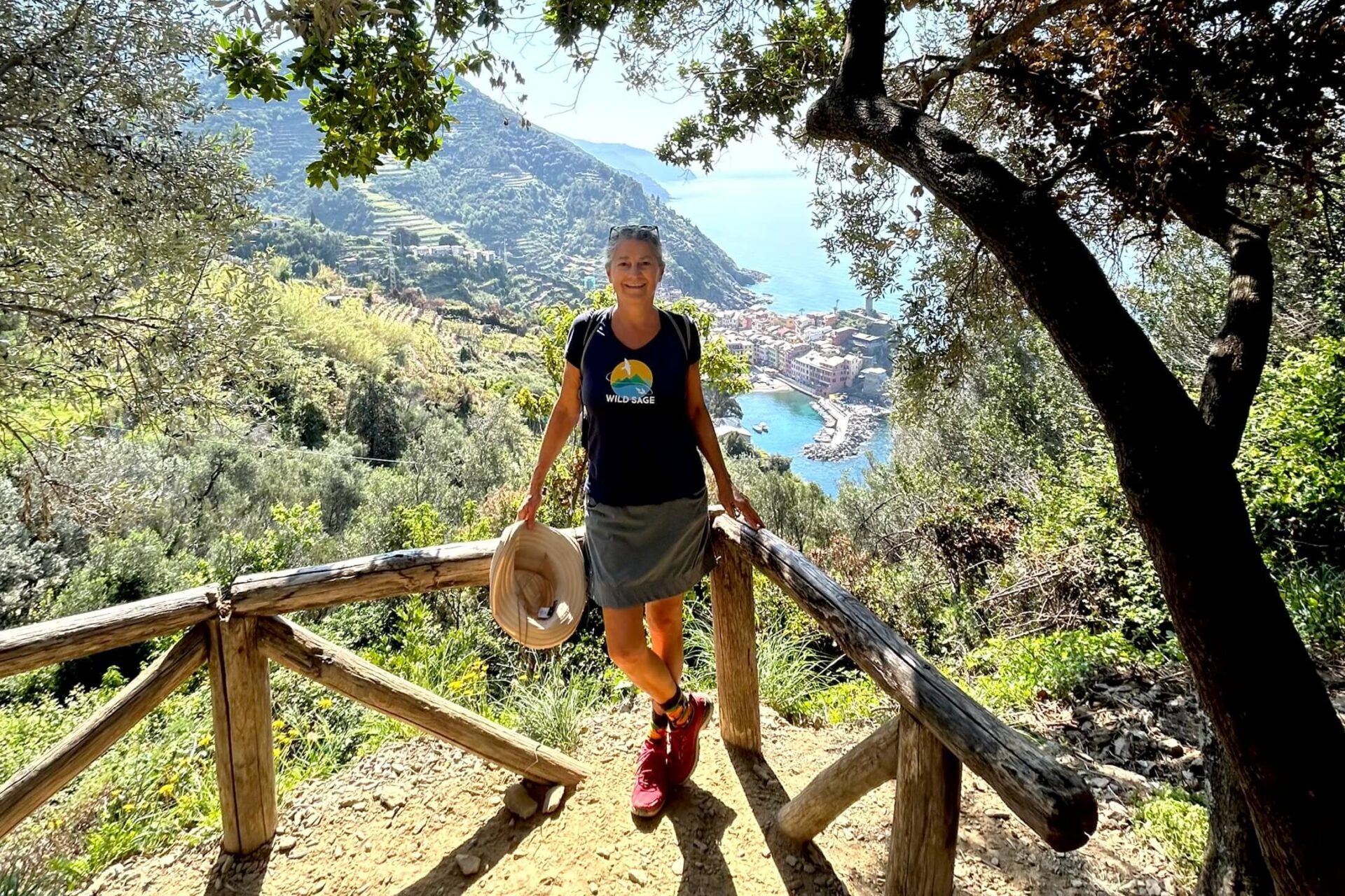 Woman hiker on a trail above the village of Vernazza in this quick guide to the Cinque Terre