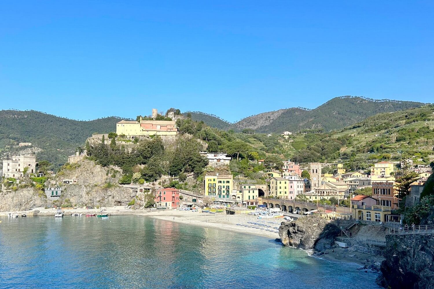 Quick guide to the Cinque Terre has the village of Monterosso on the water