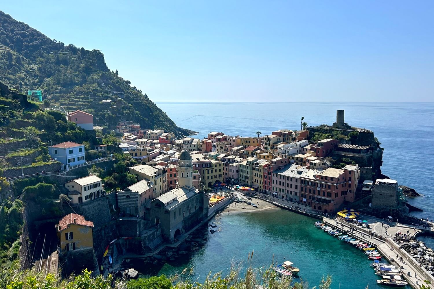Colorful town of Vernazza around a blue bay in the Cinque Terre